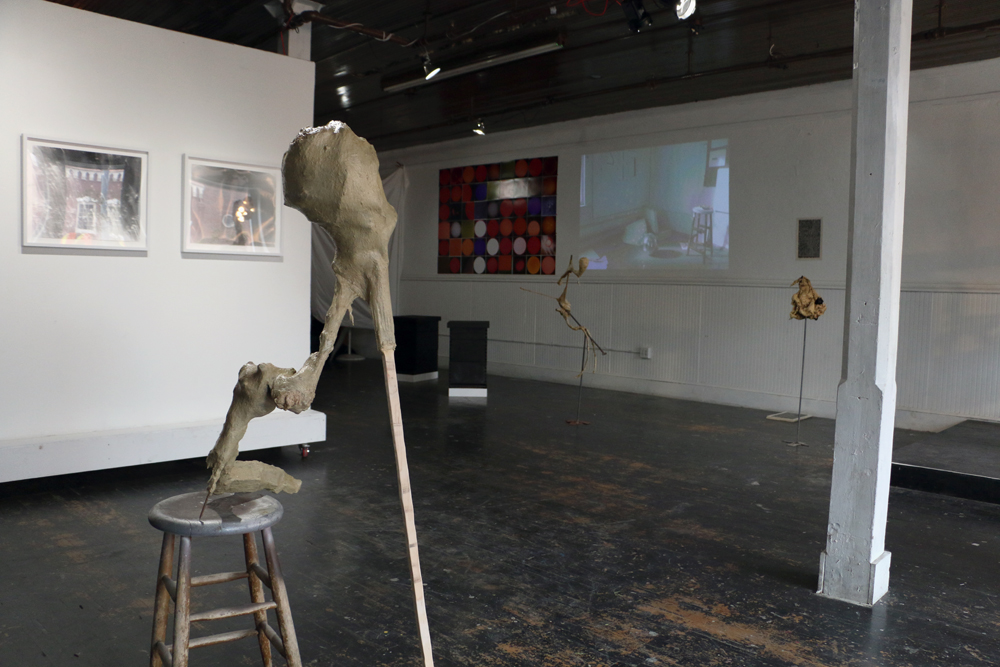 L to R: Stephanie Dowda, We are the Lightning , 2013; Andrew Boatright, Untitled , 2014; morgan alexander, where have they gone? where are we going? (charred) , 2014; Ian Cone, Heliocentric Revolution #1-42 , 2014; Andrew Boatright, Candle in t